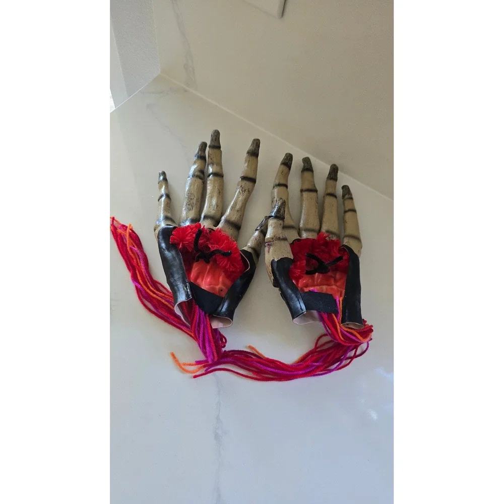 Skeleton Hand Prop Pair Realistic Bone Finish with Yarn Fringe Halloween Decor